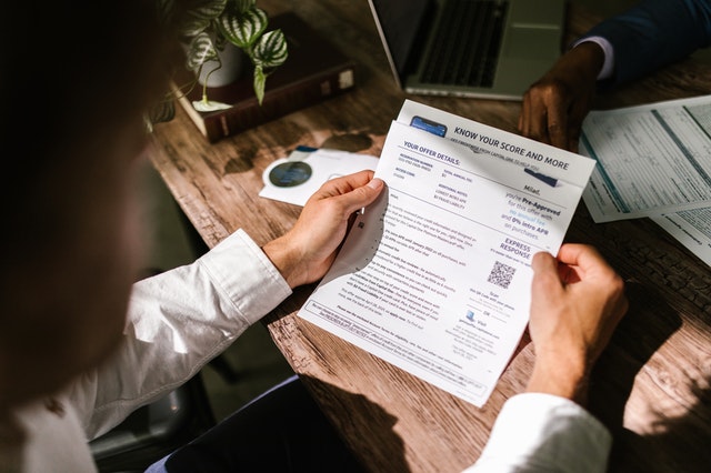person looking at credit report